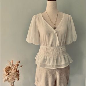 Cottage style white v-neck blouse. Perfect for modern styling.